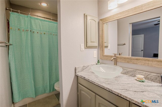 111 Lexington Ln, Victoria, TX 77901 - full bathroom with a shower with shower curtain, toilet, vanity, and recessed lighting