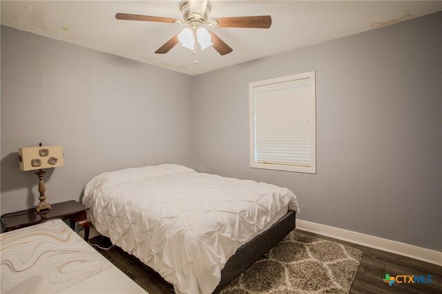 111 Lexington Ln, Victoria, TX 77901 - bedroom with ceiling fan, baseboards, and dark wood-style flooring