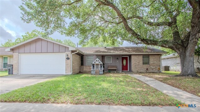 111 Lexington Ln, Victoria, TX 77901 - single story home featuring an attached garage, brick siding, a front yard, and concrete driveway
