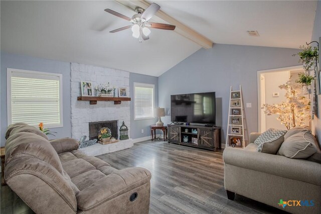 111 Lexington Ln, Victoria, TX 77901 - living room featuring wood finished floors, lofted ceiling with beams, ceiling fan, a fireplace, and baseboards