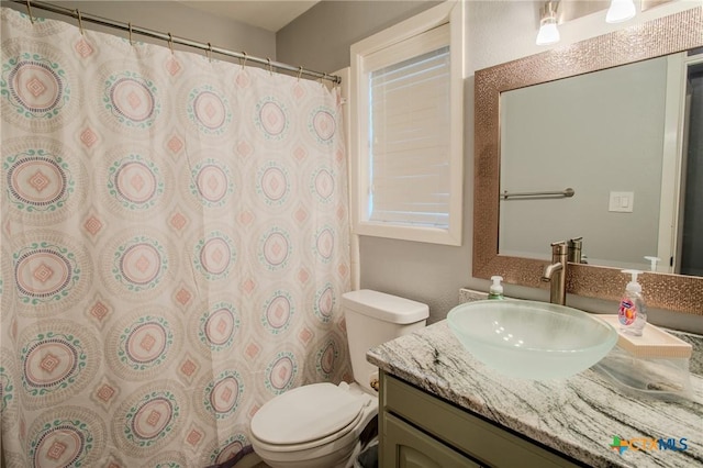 111 Lexington Ln, Victoria, TX 77901 - bathroom with vanity, a shower with shower curtain, and toilet