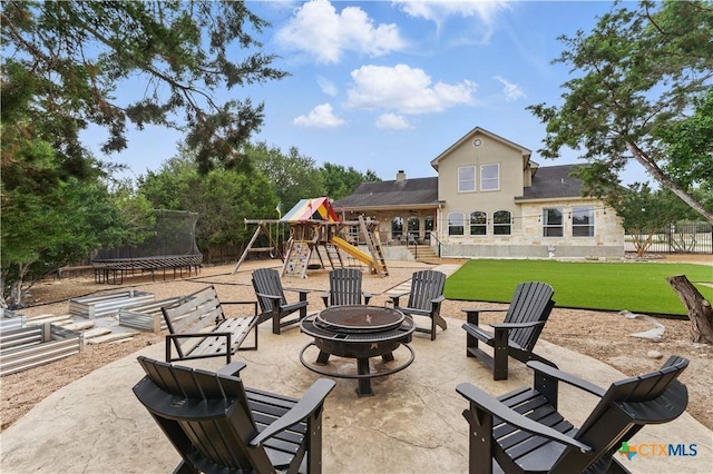 810 Pinnacle Pkwy, New Braunfels, TX 78132 - view of patio featuring an outdoor fire pit and a trampoline