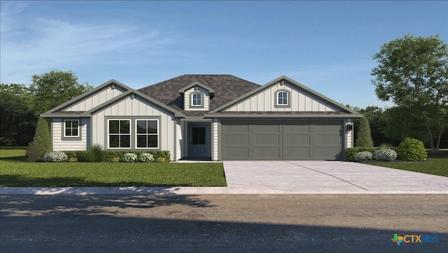 view of front of property featuring a front yard, driveway, an attached garage, a shingled roof, and board and batten siding