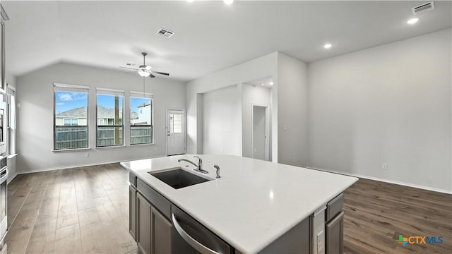 3938 Legend Park, New Braunfels, TX 78130 - kitchen with stainless steel dishwasher, dark wood-style floors, light countertops, vaulted ceiling, and recessed lighting