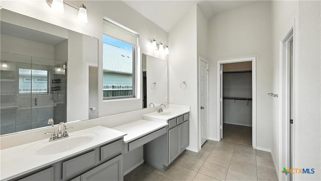 3938 Legend Park, New Braunfels, TX 78130 - full bath featuring double vanity, a shower stall, tile patterned floors, and a spacious closet