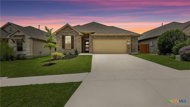 3938 Legend Park, New Braunfels, TX 78130 - view of front of house featuring a garage, concrete driveway, and brick siding