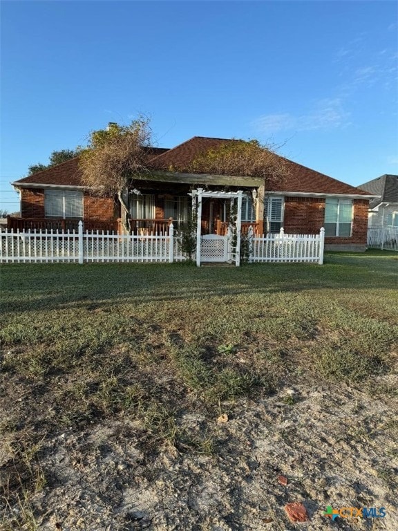 back of house with a yard