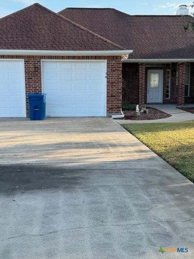 single story home with a garage