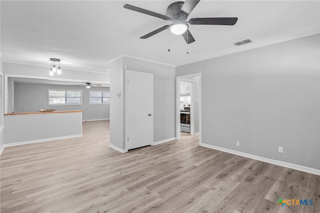 unfurnished living room with a textured ceiling, crown molding, and light hardwood / wood-style flooring