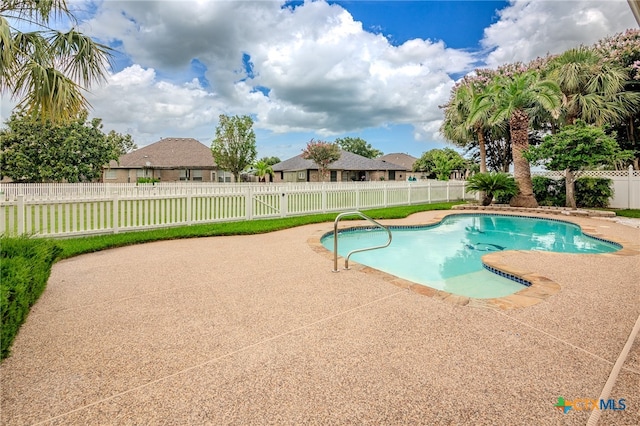 view of pool featuring a patio area