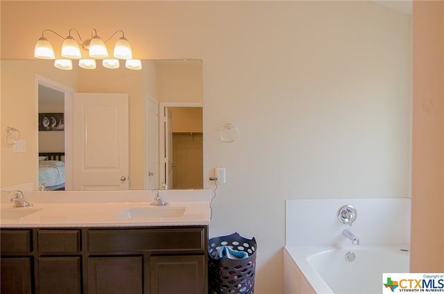 bathroom with a bathing tub and vanity