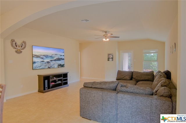 living room featuring vaulted ceiling and ceiling fan