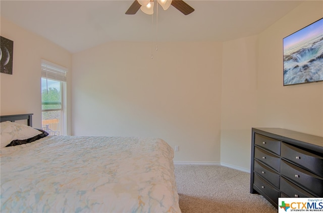 bedroom with light carpet, ceiling fan, and lofted ceiling