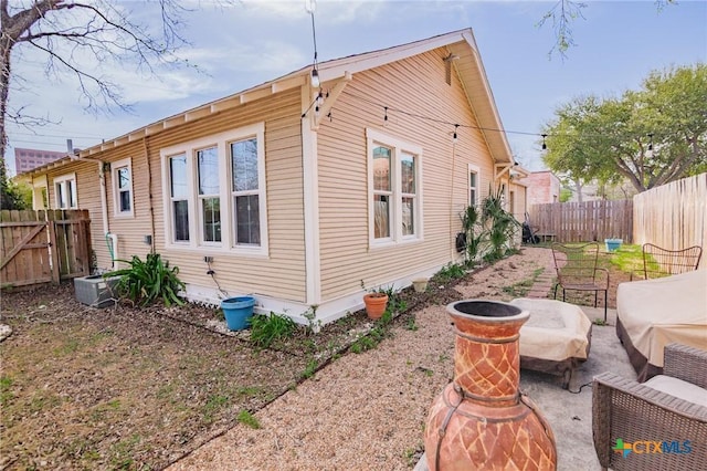 104 E Stayton Ave, Victoria, TX 77901 - view of home's exterior featuring cooling unit and a fenced backyard
