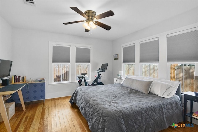 104 E Stayton Ave, Victoria, TX 77901 - bedroom with visible vents, ceiling fan, baseboards, and hardwood / wood-style floors