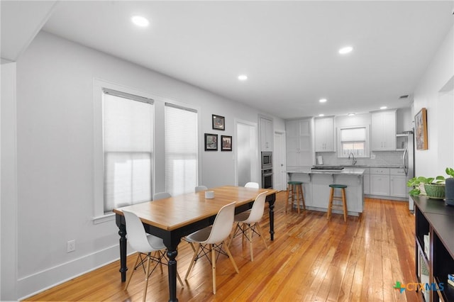 104 E Stayton Ave, Victoria, TX 77901 - dining space featuring recessed lighting, baseboards, and light wood-style flooring