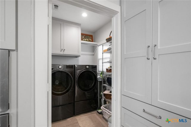 104 E Stayton Ave, Victoria, TX 77901 - laundry area with cabinet space, recessed lighting, separate washer and dryer, and visible vents