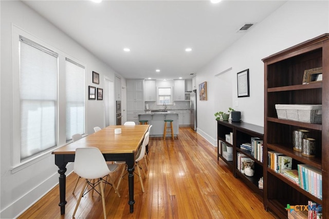104 E Stayton Ave, Victoria, TX 77901 - dining space with light wood-style flooring, recessed lighting, baseboards, and visible vents