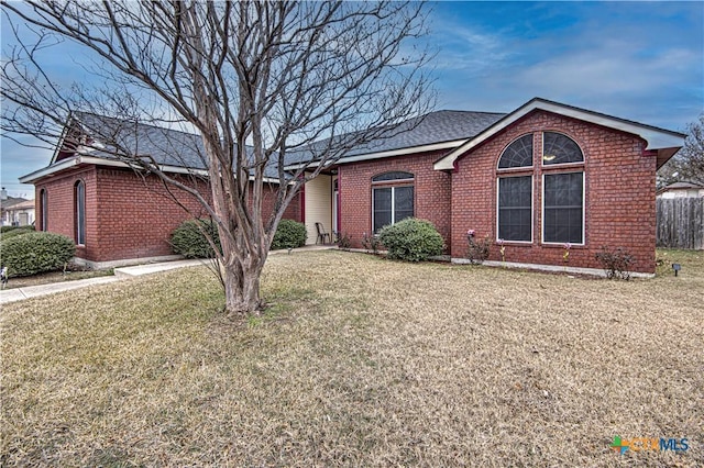 ranch-style house with a front lawn