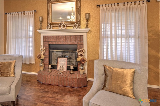 living area featuring hardwood / wood-style floors and a fireplace