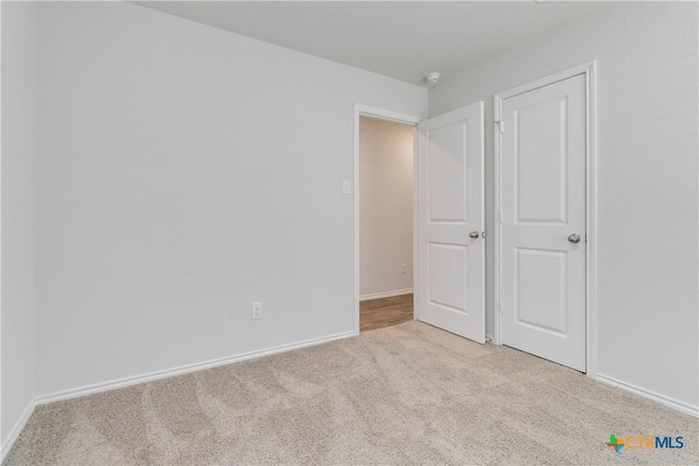 2969 Wolfcreek, New Braunfels, TX 78130 - unfurnished bedroom featuring carpet floors and baseboards