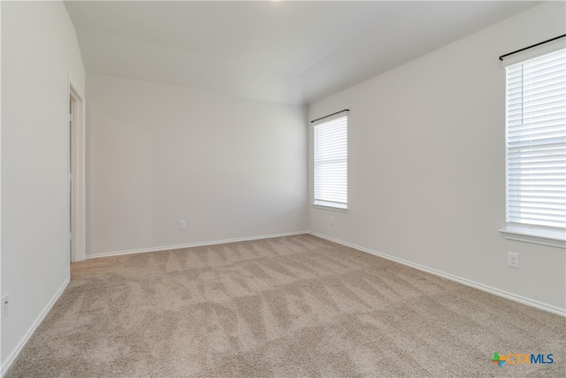 unfurnished room with light carpet