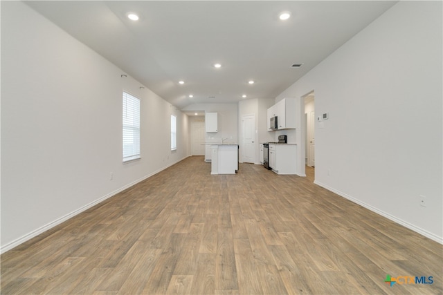 unfurnished living room with light wood-type flooring