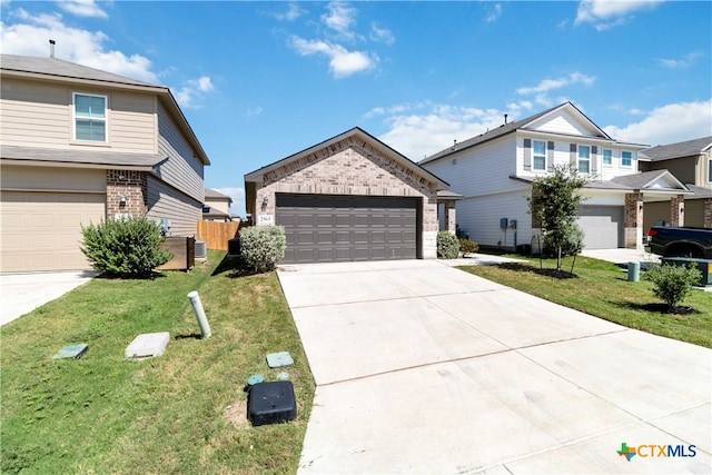 view of front of house featuring a garage and a front yard