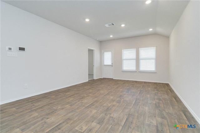 2969 Wolfcreek, New Braunfels, TX 78130 - spare room with wood finished floors, recessed lighting, and baseboards