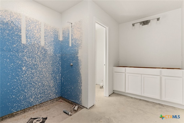 bathroom featuring concrete floors