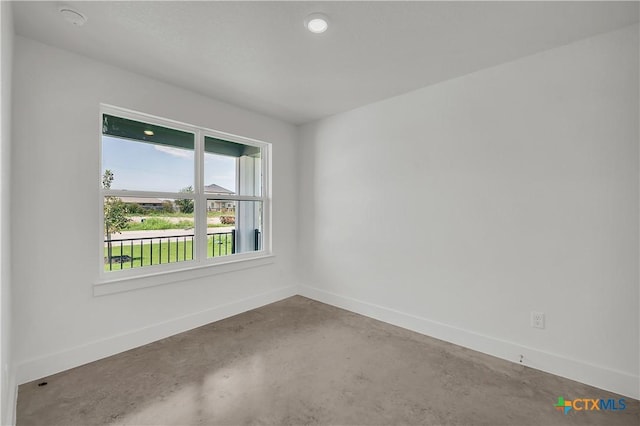 spare room featuring concrete floors