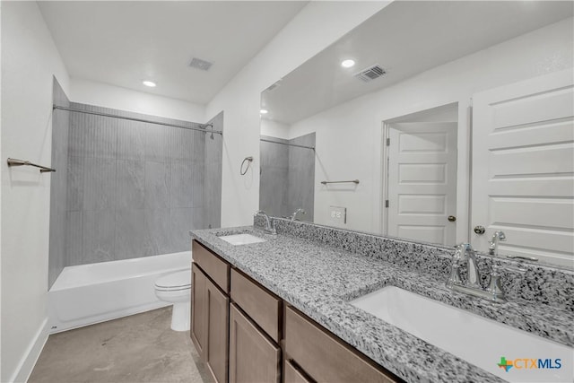 full bathroom with vanity, tiled shower / bath, and toilet