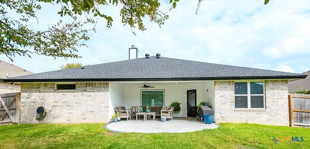 back of property featuring a patio area, a yard, and ceiling fan