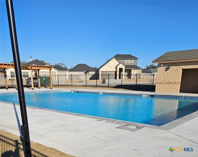 pool featuring a residential view and fence