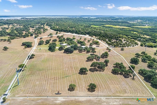 birds eye view of property with a rural view