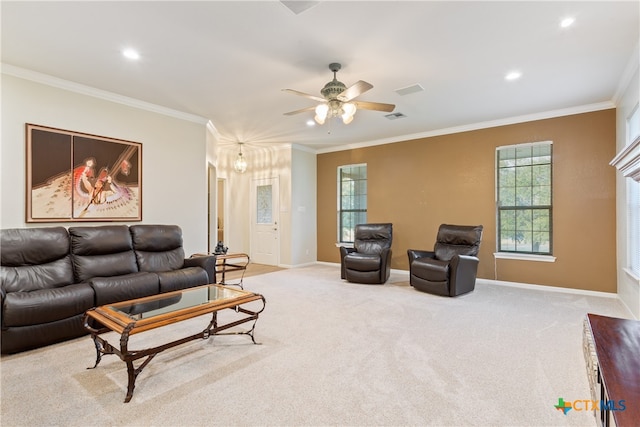 carpeted living room with ceiling fan and crown molding