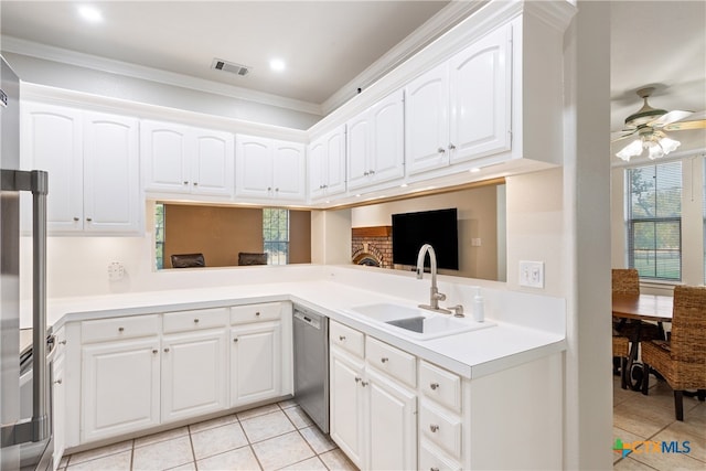 kitchen featuring white cabinetry, sink, light tile patterned floors, crown molding, and dishwasher