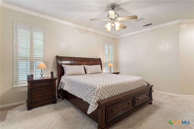 bedroom with ceiling fan, light carpet, and crown molding