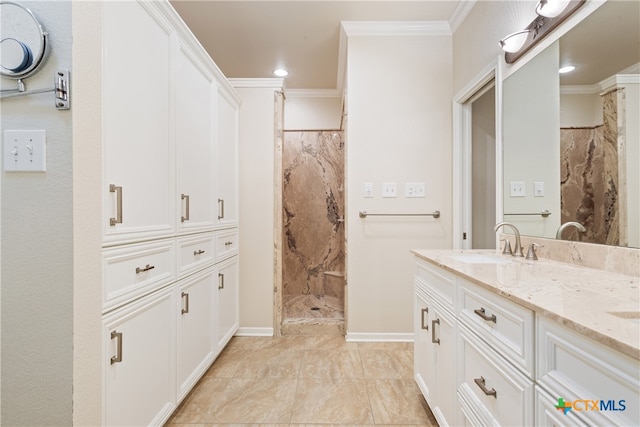 bathroom featuring a shower, vanity, and crown molding