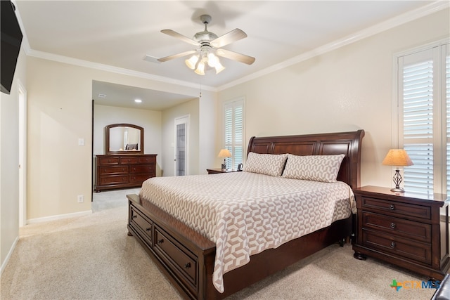 bedroom with ceiling fan, ornamental molding, and light colored carpet