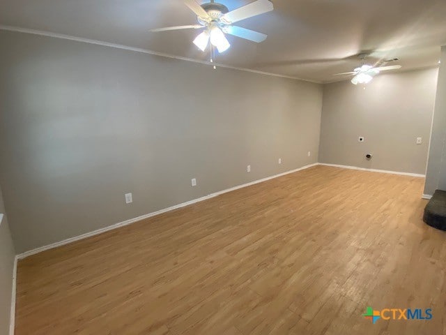 720 S Laurel Ave, Luling, TX 78648 - spare room with ceiling fan, wood finished floors, and crown molding