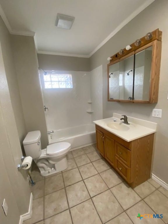 720 S Laurel Ave, Luling, TX 78648 - full bathroom featuring vanity, ornamental molding, tile patterned floors, and tub / shower combination