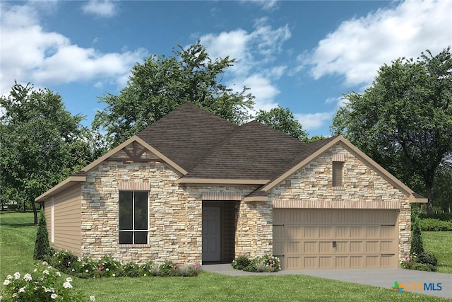 view of front of house featuring a garage and a front yard