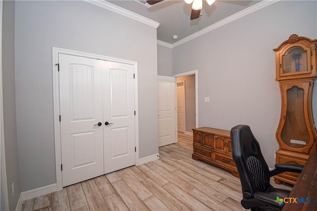 office featuring crown molding, light wood finished floors, ceiling fan, and baseboards