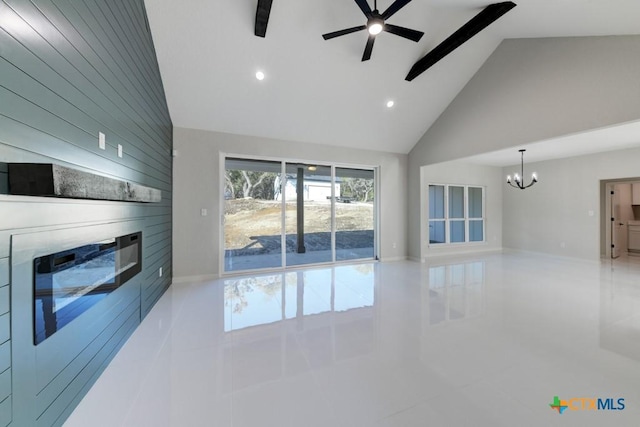 living room featuring ceiling fan with notable chandelier, light tile patterned floors, high vaulted ceiling, beamed ceiling, and a fireplace