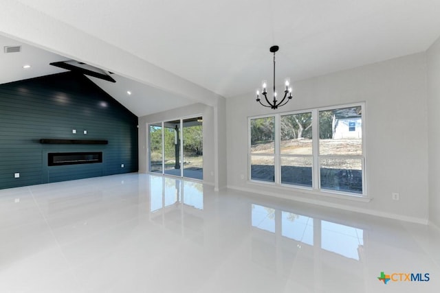 unfurnished living room featuring tile patterned flooring, ceiling fan with notable chandelier, vaulted ceiling, and a wealth of natural light