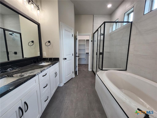 412 Talon, Salado, TX 76571 - bathroom featuring a shower stall, a spacious closet, double vanity, a sink, and a bath