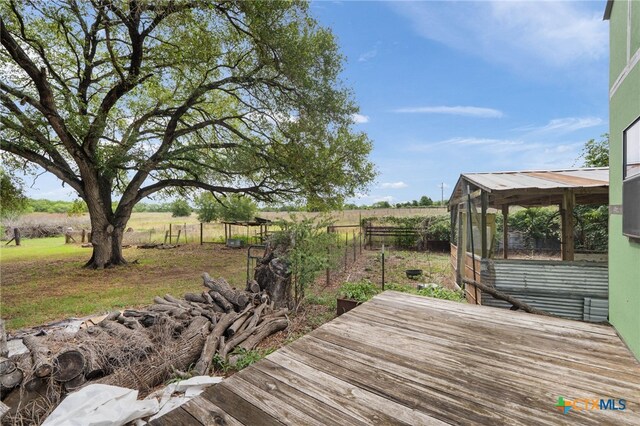 10843 US Highway 90, Harwood, TX 78632 - wooden deck featuring a greenhouse, a rural view, and an outdoor structure