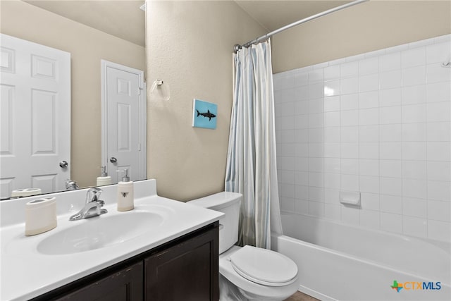 full bathroom with shower / bath combo, vanity, and toilet