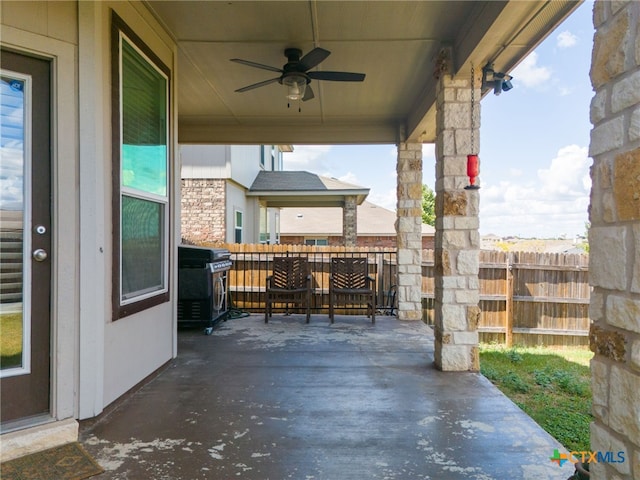 view of patio featuring area for grilling and ceiling fan